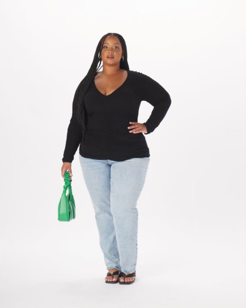 Front of a model wearing a size 2X Leonor Ruched Full Length Top in Black in Black by What Lo Wants. | dia_product_style_image_id:273994